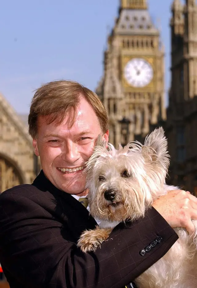 David Amess with a dog