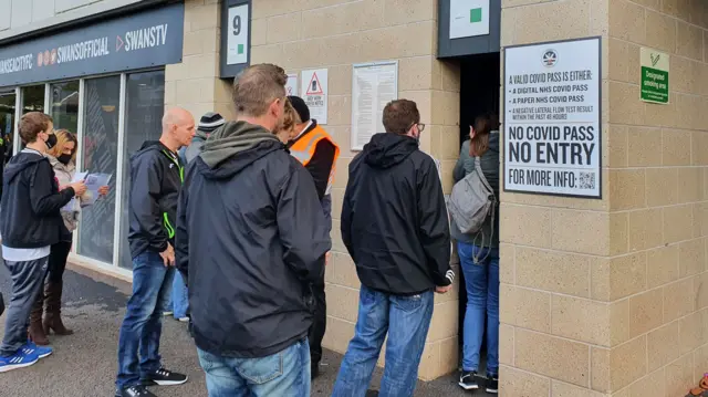 Fans queue at Swansea.com Stadium