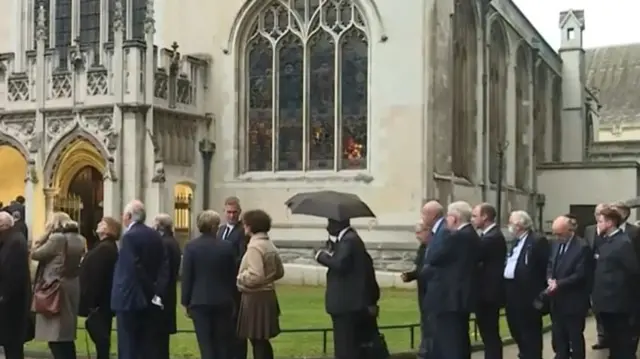 MPs queue to enter the church