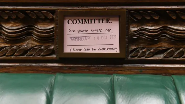 Sir David Amess' place card on a seat in parliament