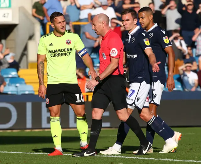 Billy Sharp and Jake Wallace both make their point to referee Andy Davies