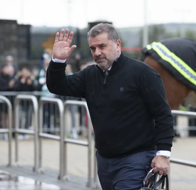 Celtic manager Ange Postecoglou arriving at a rainy Celtic Park