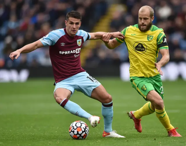 Ashley Westwood holds off Teemu Pukki