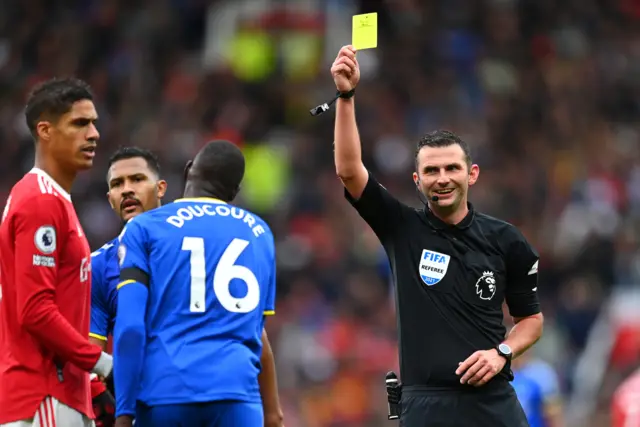 Abdoulaye Docoure is booked by Michael Oliver