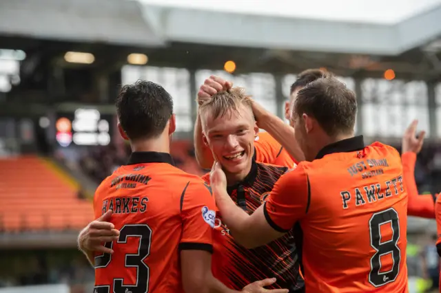 Imari Niskanen (centre) scores in the first half for Dundee United