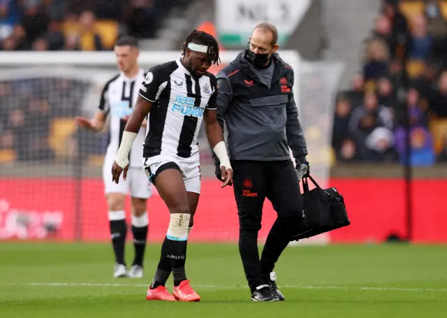 Allan Saint-Maximin is attended to by a physio