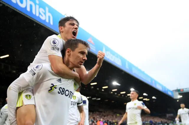 Daniel James celebrates with Diego Llorente