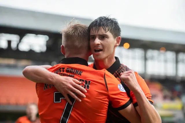 Dundee United goalscorer Ilmari Niskanen is congratulated by teammate Ian Harkes