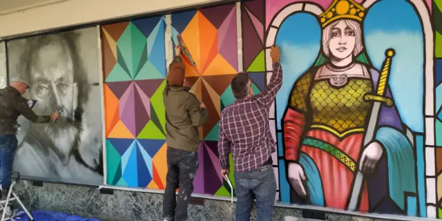 Street artists painting the new mural includes a "futuristic pattern" of Tamworth's crest and warrior queen Aethelflaed