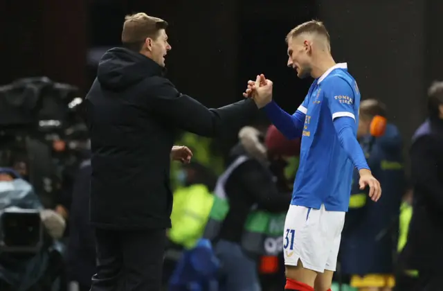 Steven Gerrard with Borna Barisic at full-time