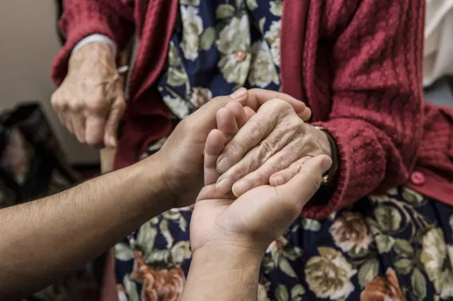 File image of a woman in a care home