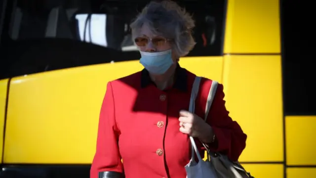 A woman wearing a face mask is seen on 08 October, 2021 in Warsaw, Poland