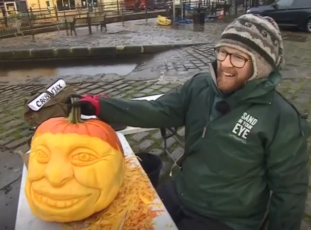 Artist Jamie Wardley and his pumpkin carving of Jude Walker