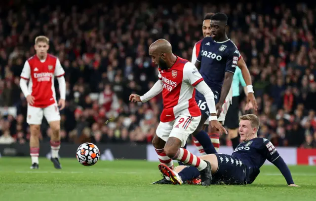 Alexandre Lacazette is fouled by Matt Targett