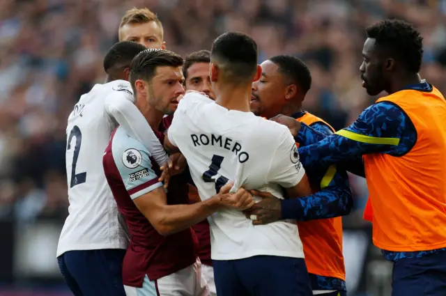 West Ham and Tottenham players scuffle