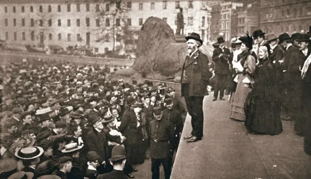 Keir Hardie addressing the first women's suffrage demonstration, Trafalgar Square, London, 19 May 1906. Hardie (1856-1915) was a Scottish trade unionist and politician who was one of the founders of the Labour Party and its first Member of Parliament. He was a firm supporter of the campaign for women to receive the vote. Leading suffragettes Emmeline Pankhurst (1858-1928) and Elizabeth Clarke Wolstenholme Elmy (1833-1918) can be seen in the centre of the platform. (