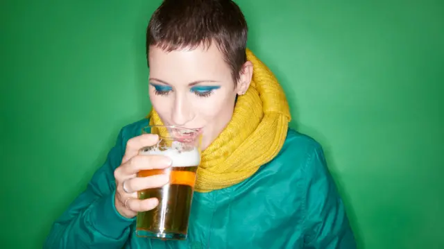 Woman drinking lager