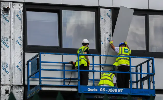 File pic of cladding being removed from a building in Manchester