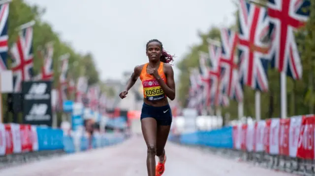 Brigid Kosgei running down the Mall