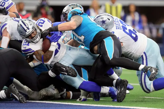 Ezekiel Elliott of Dallas Cowboys scores a touchdown against Carolina Panthers.