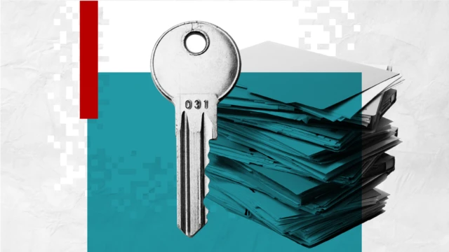 A graphic of a key in front of a stack of documents