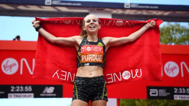 Charlotte Purdue at the finish line