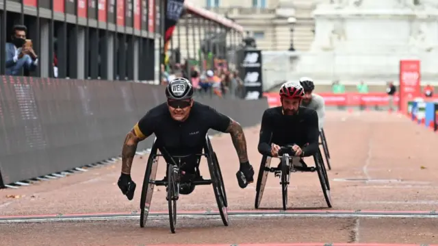 David Weir crosses the finish line