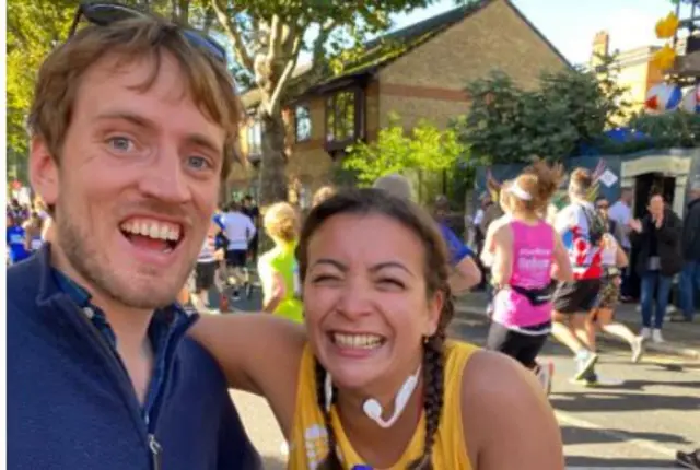 Eleanor Mahmoud smiles with boyfriend Rupert on the course