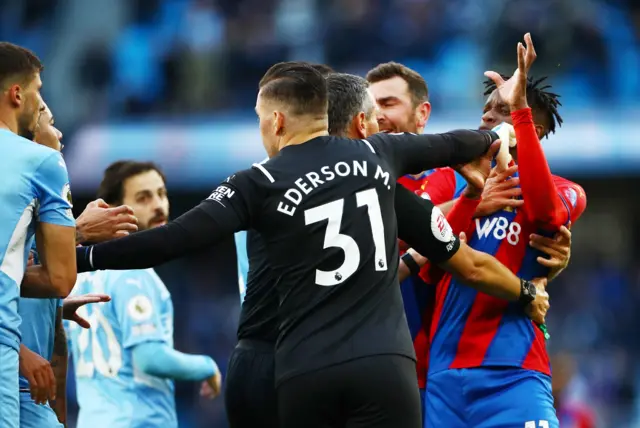 Ederson breaks up a scuffle