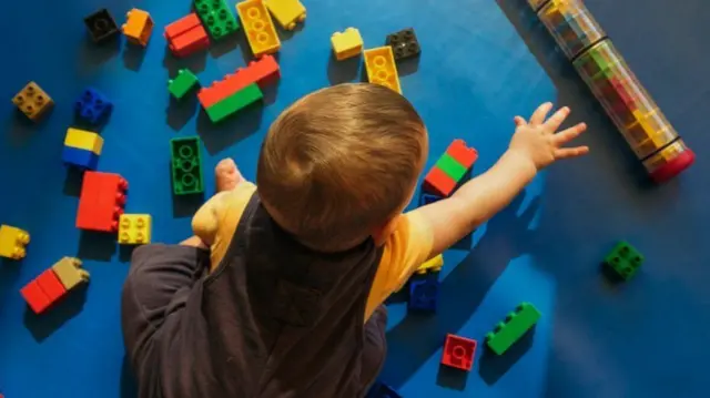 A young child playing with toys