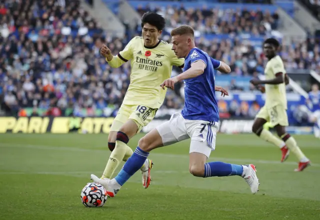 Leicester City's Harvey Barnes in action with Arsenal's Takehiro Tomiyasu