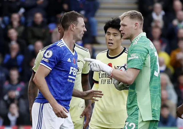 Aaron Ramsdale and Jonny Evans come together