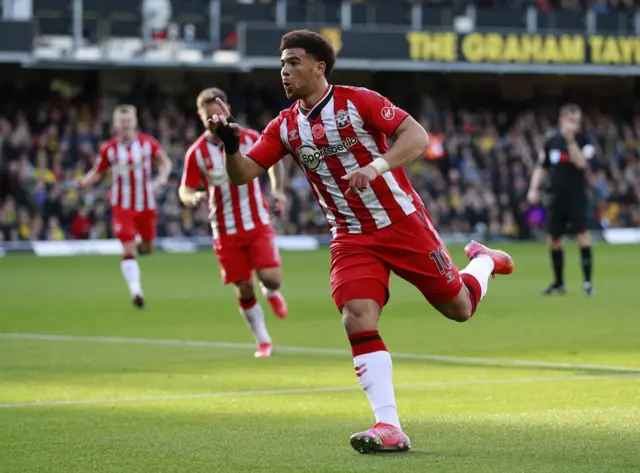 Che Adams celebrates