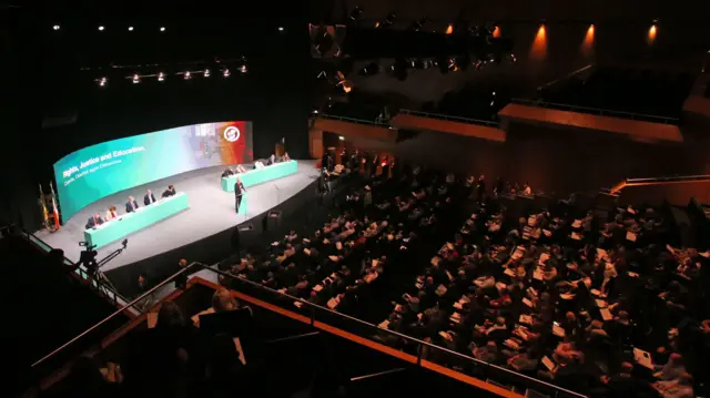 Delegates watch a speech at the Sinn Féin party conference at Dublin City University