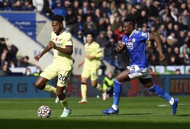 Leicester's Daniel Amartey (R) in action against Arsenal's Nuno Tavares