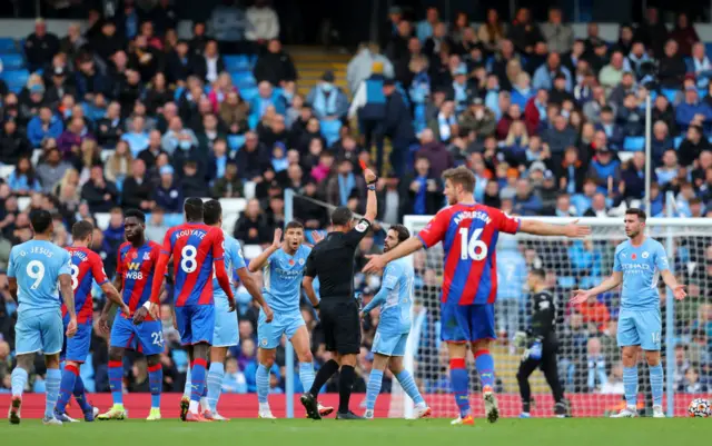 Aymeric Laporte is shown a red card