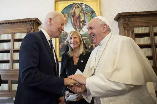 This handout picture provided by the Vatican Media shows Pope Francis and President Biden