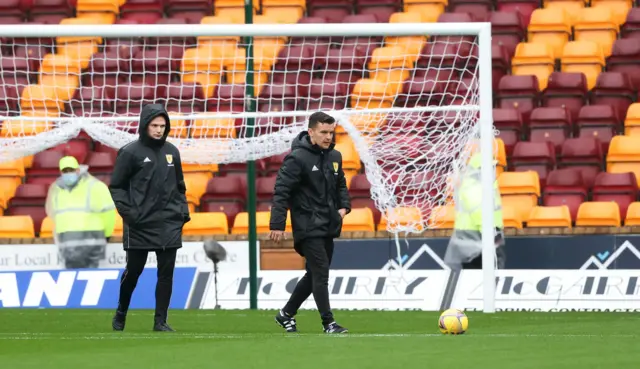 Referee Nick Walsh inspecting the Fir Park pitch earlier