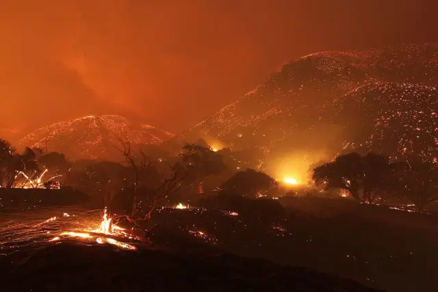 Global warming will lead to an increasing number of wildfires, as seen here in California, and flooding