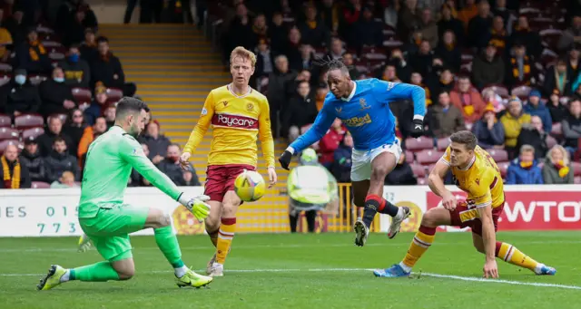 Motherwell's Liam Kelly makes a save to deny Rangers' Joe Aribo