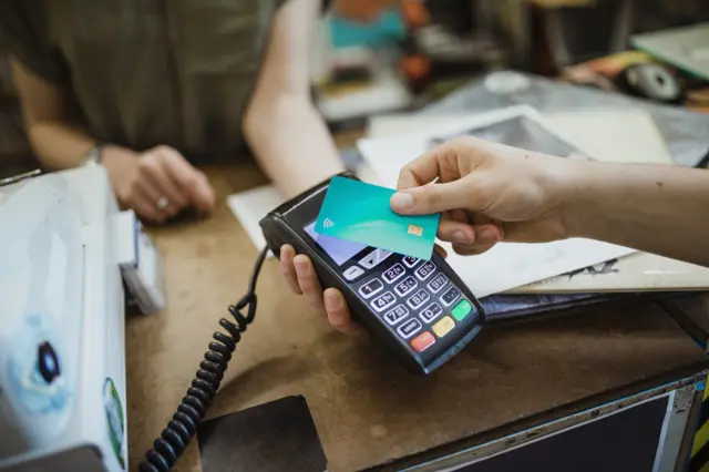 Person making contactless card payment