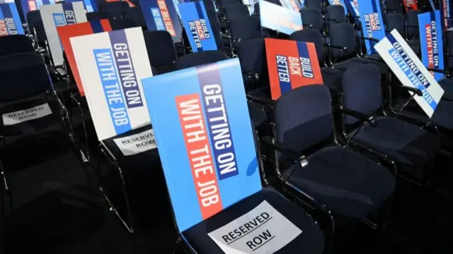 Placards have been placed on the seats in the auditorium ready for Boris Johnson's speech