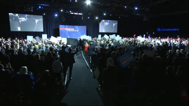 Audience waved their placards as the PM left the stage