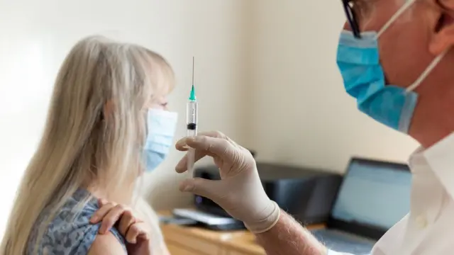 A vaccine being administered