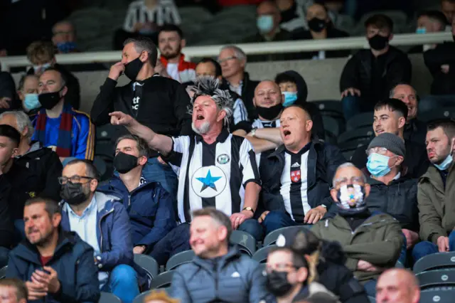 Newcastle fans sing at match