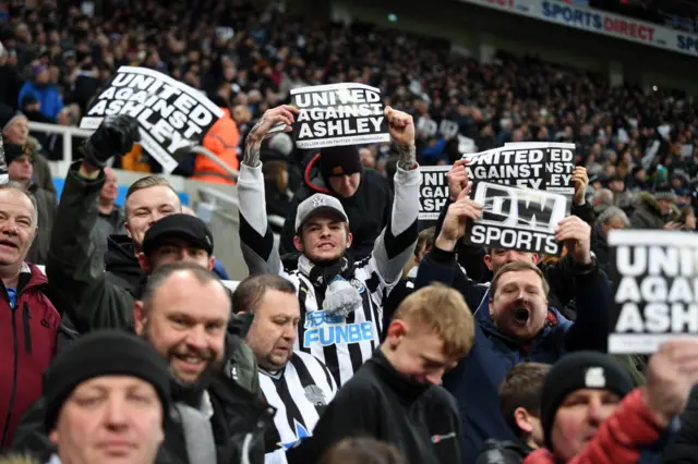 Fans holding Ashley out signs