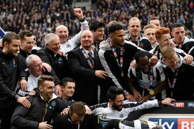 Managers and players celebrate title