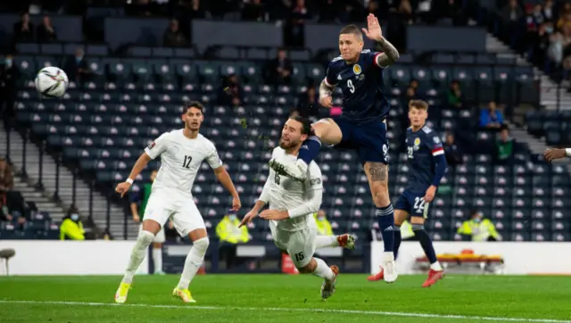 Scotland's Lyndon Dykes scores