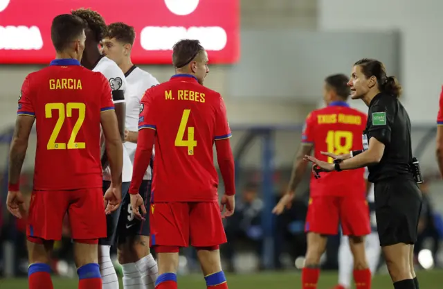 Andorra players spoken to by the referee