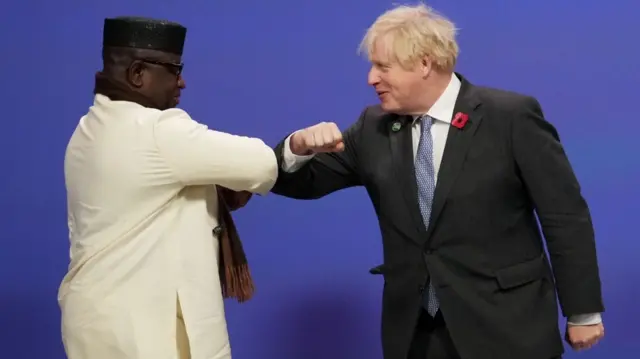 Boris Johnson greets Sierra Leone President Julius Maada Bio